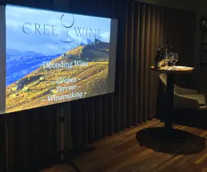 A slideshow on wine being presented to guests at a Cree Wine class. 