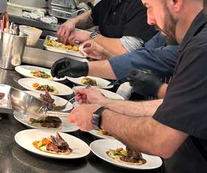 Line cooks busy at work in our kitchen